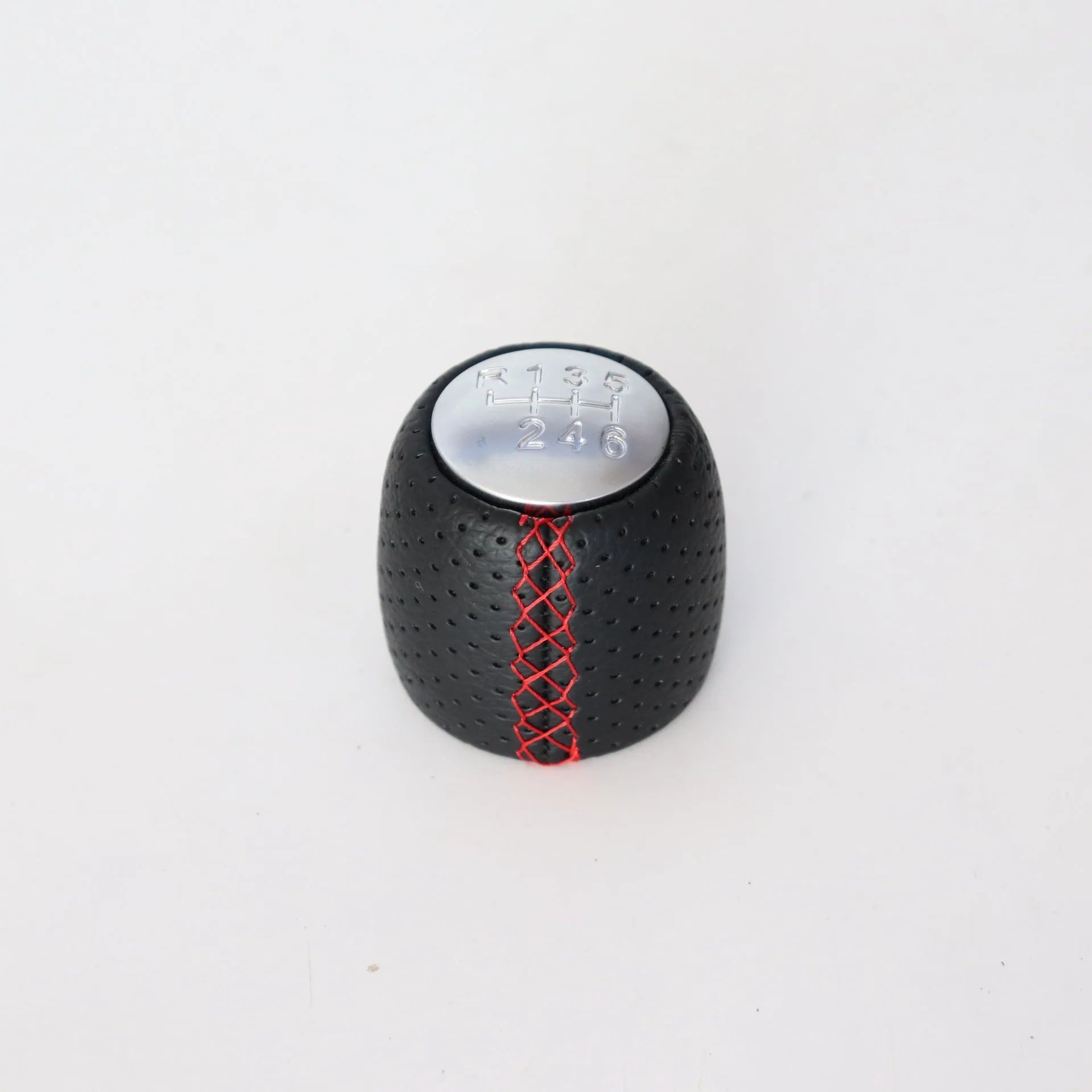 Sewn wrapped perforated leather gear knob for Alpha car in black, red, or white with matte or silver cover.