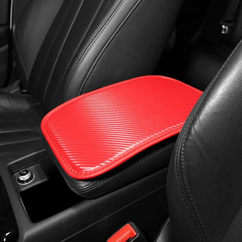 Leather car armrest box mat in black, shown on a car centre console.