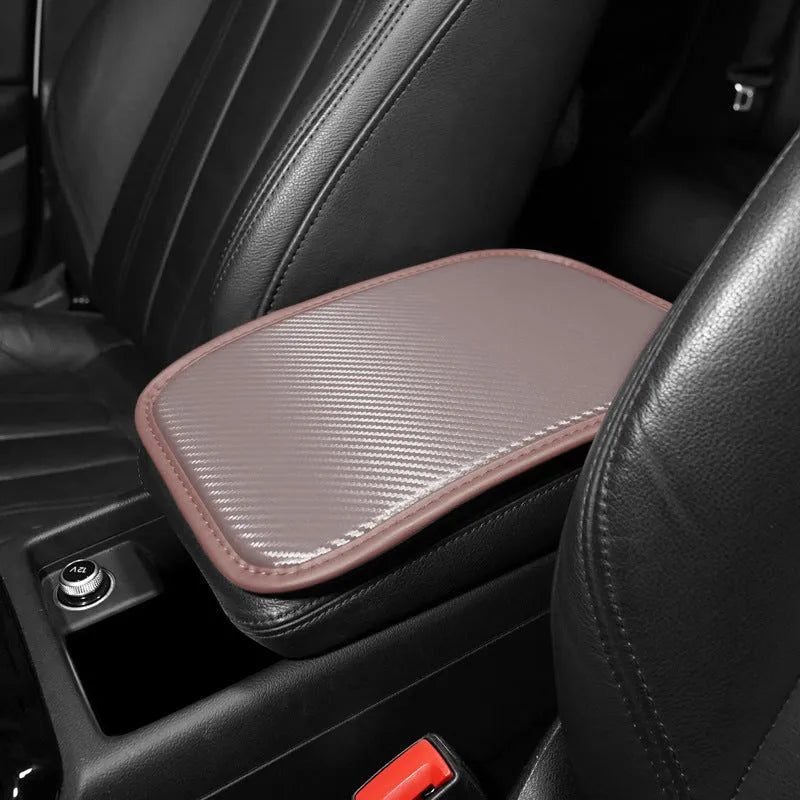 Leather car armrest box mat in black, shown on a car centre console.