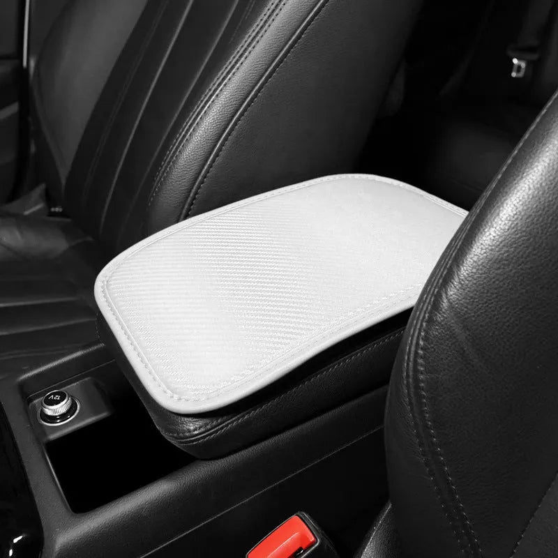 Leather car armrest box mat in black, shown on a car centre console.