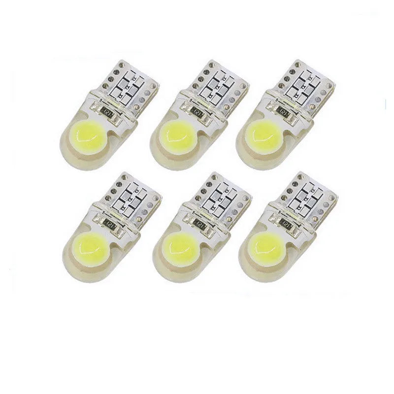 Ten T10 LED bulbs for cars in various colours including blue, red, and white, showing their 21.5mm length.
