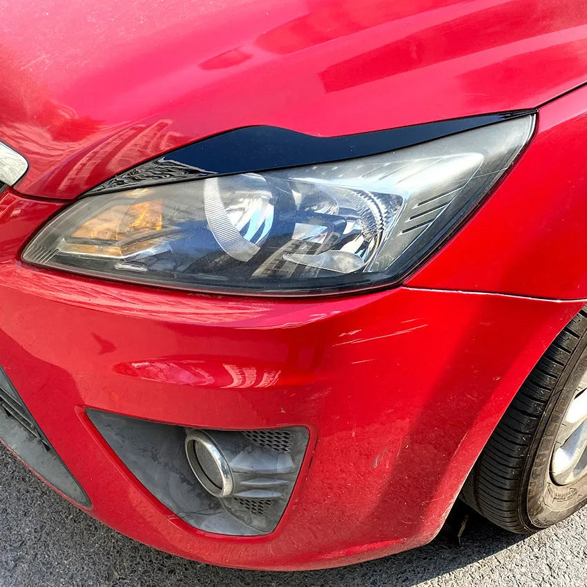 Ford Focus headlight sticker set in carbon fibre pattern or piano black finish