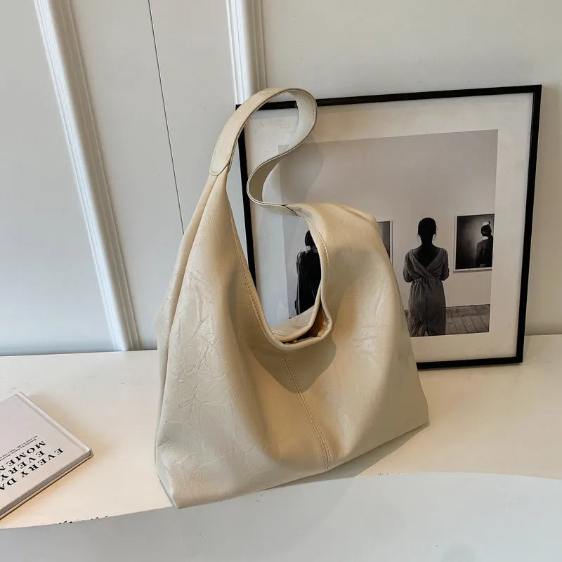 Soft leather shoulder bag with large capacity and sandwich pocket in street trend style