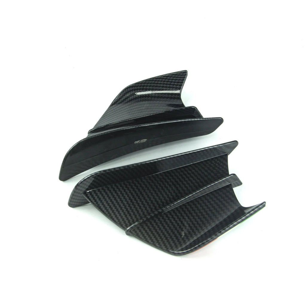Set of two universal motorcycle spoiler wings for air diversion, showing four available finish options.