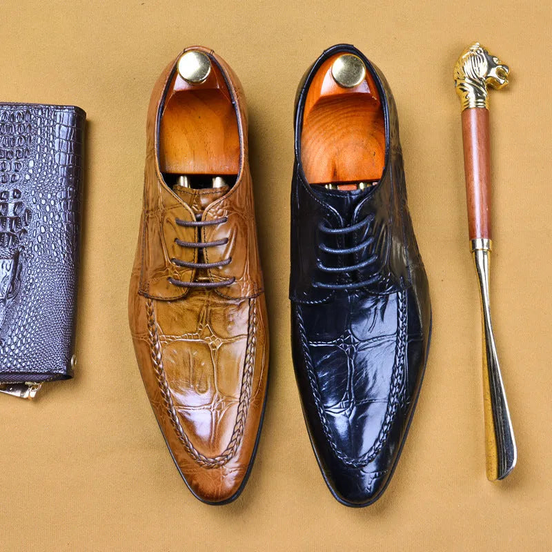 Men's black leather oxford shoes with a horse bit buckle and pointed toe on a rubber sole.