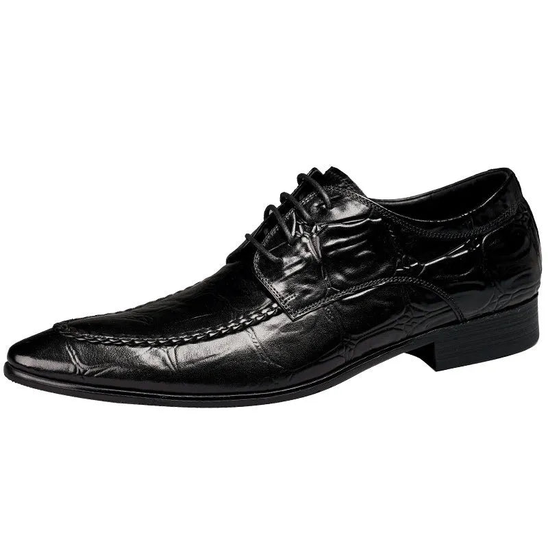 Men's black leather oxford shoes with a horse bit buckle and pointed toe on a rubber sole.