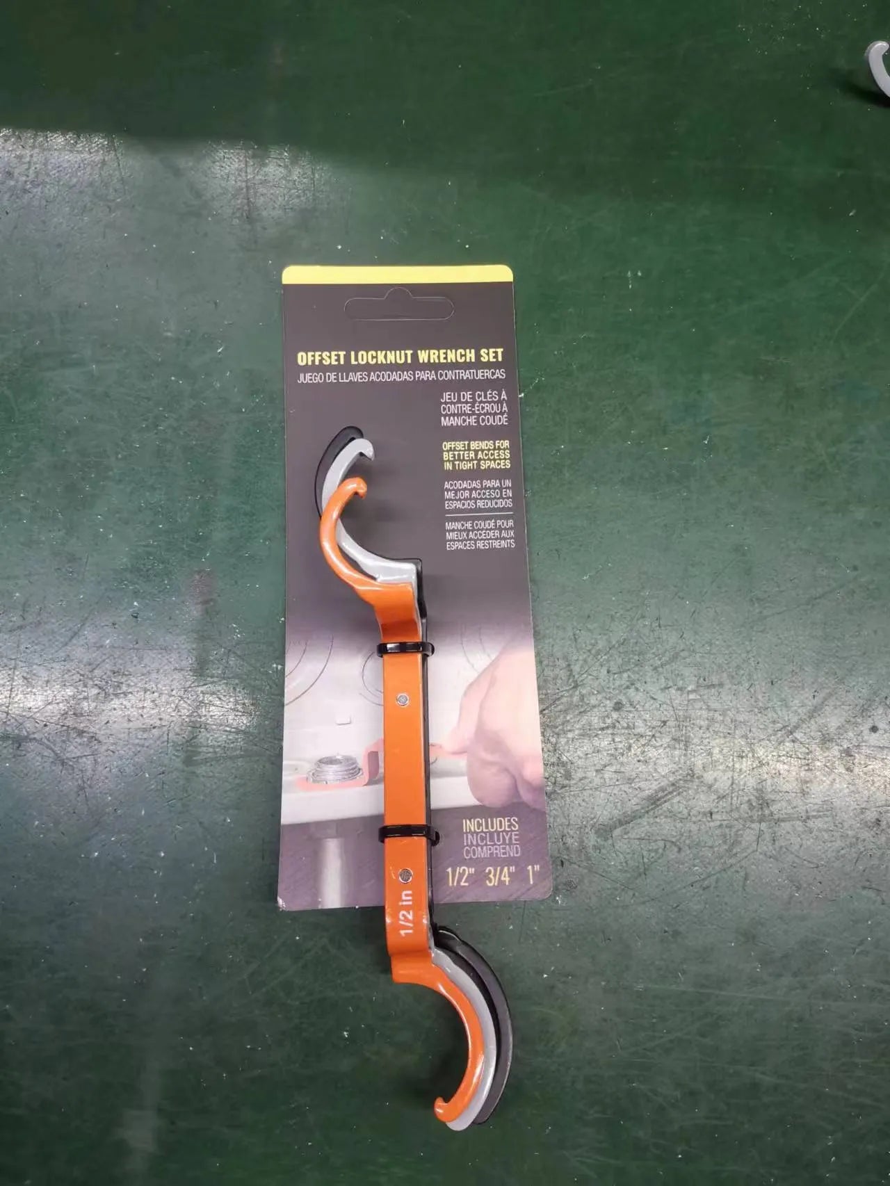 Crescent magnetic suction and catheter locking wrench three-piece set in orange, grey, and black colours