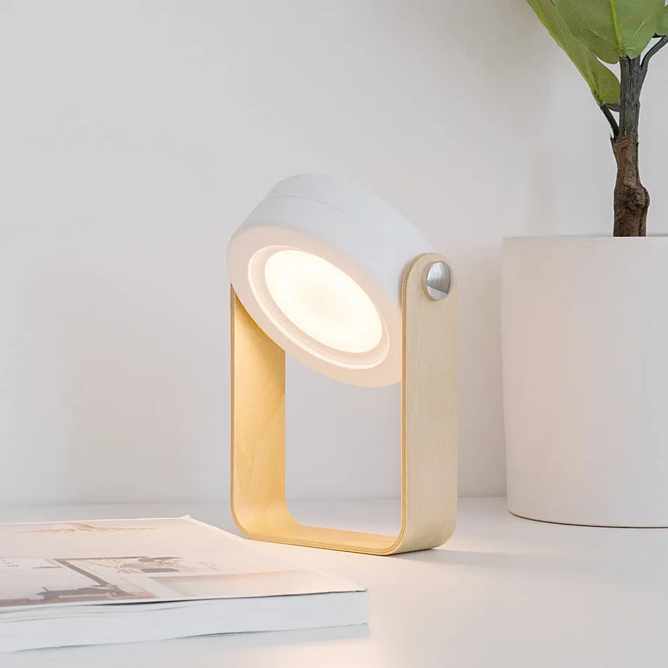 White foldable USB rechargeable LED lamp showing table lamp and lantern modes with touch dimmer.