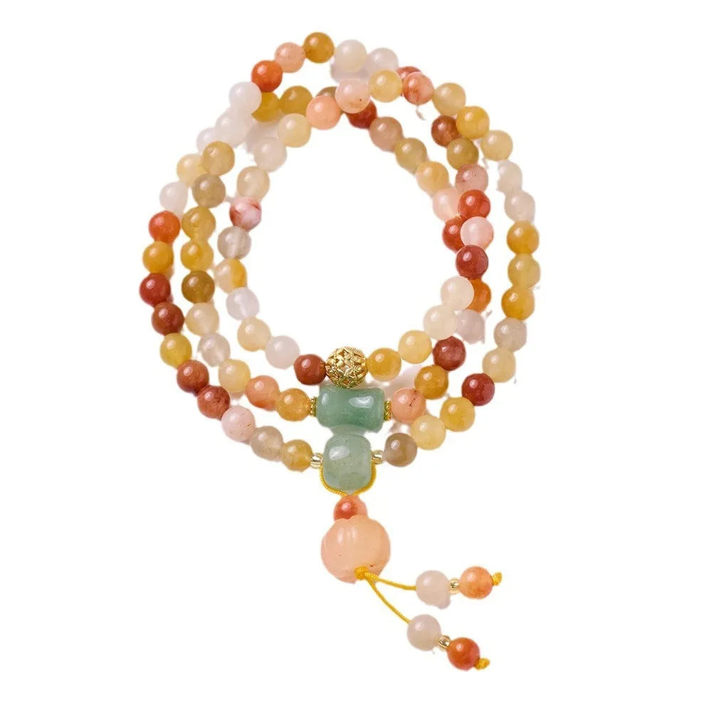 Women's green jinsi jade bracelet with golden threads and pumpkin tassel design