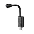 Black V380 wireless USB camera showing compact design and USB connection port.
