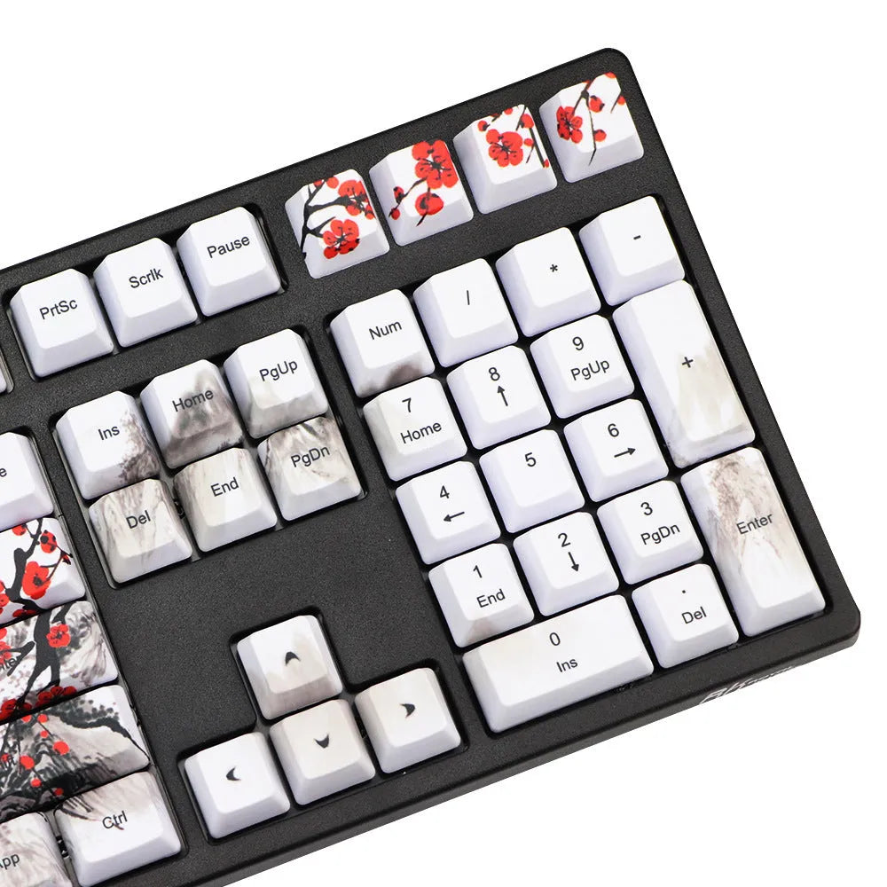 Set of 109 PBT keycaps with plum blossom design on a black background, showing Japanese legend style.