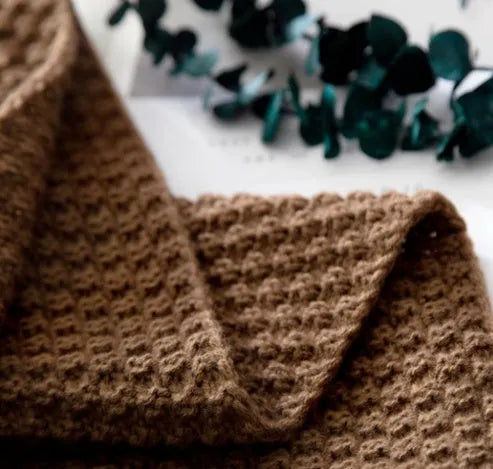 Nordic style fringed knit blanket in acrylic fabric, shown in beige colour, measuring 130 by 170 centimetres.
