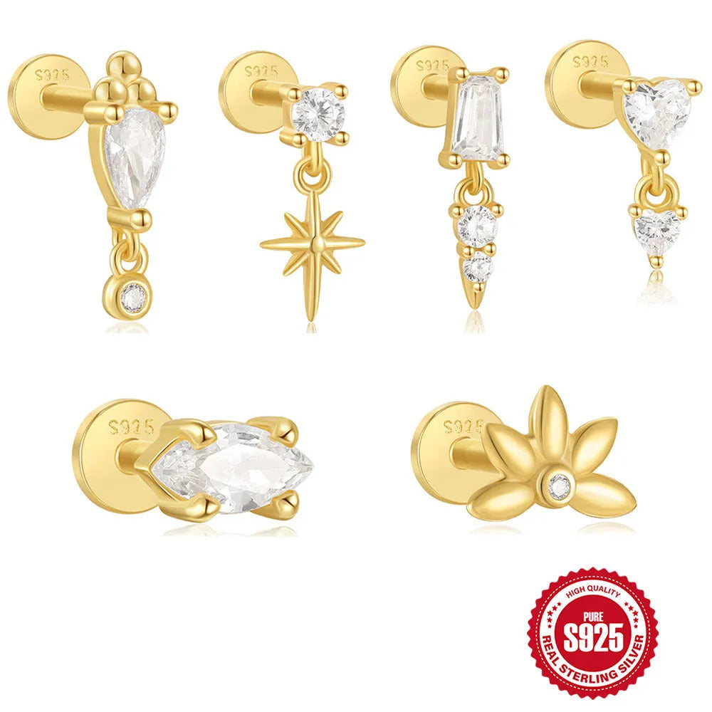 Close-up of a gold-coloured S925 sterling silver ear stud with a XINGX pattern inlay and a thin dangling tassel.