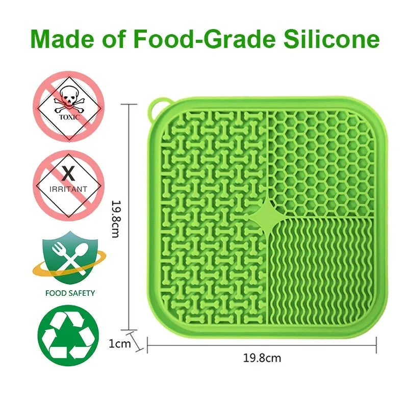 Square orange silicone dog licking mat with textured surface and suction cups on back.