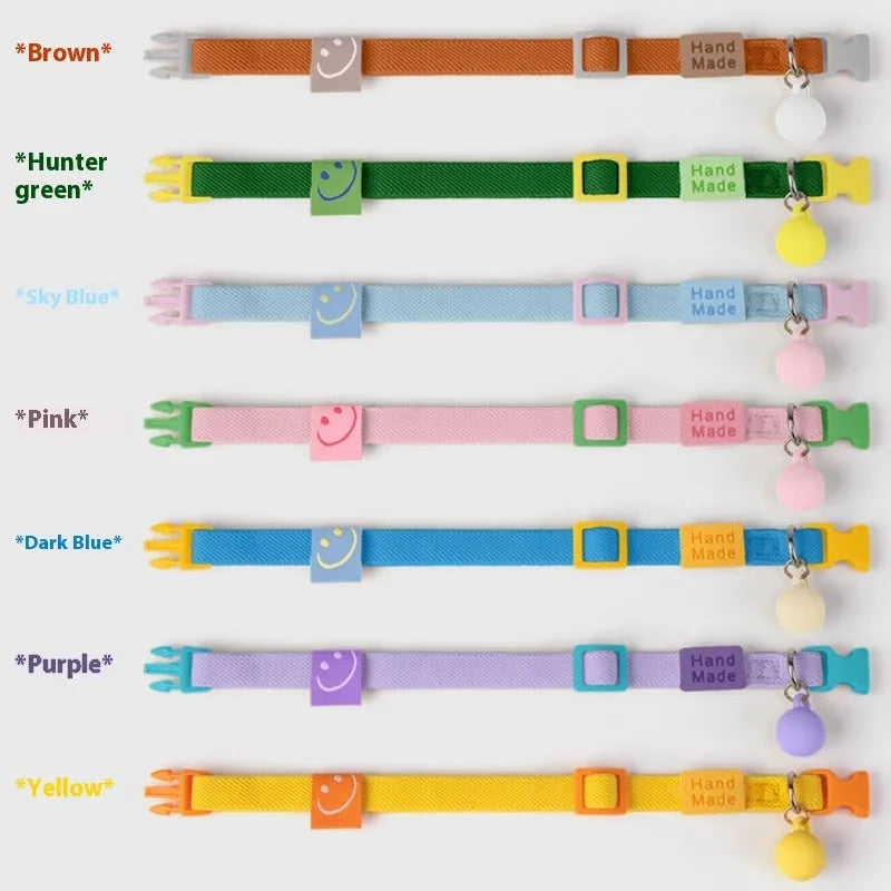 Adjustable high elasticity polyester pet collar for small dogs in seven colour options on a white background.