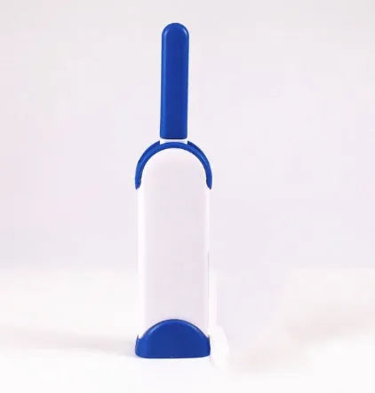 Blue reusable pet hair removal comb with double-sided sticky brush next to its self-cleaning base.