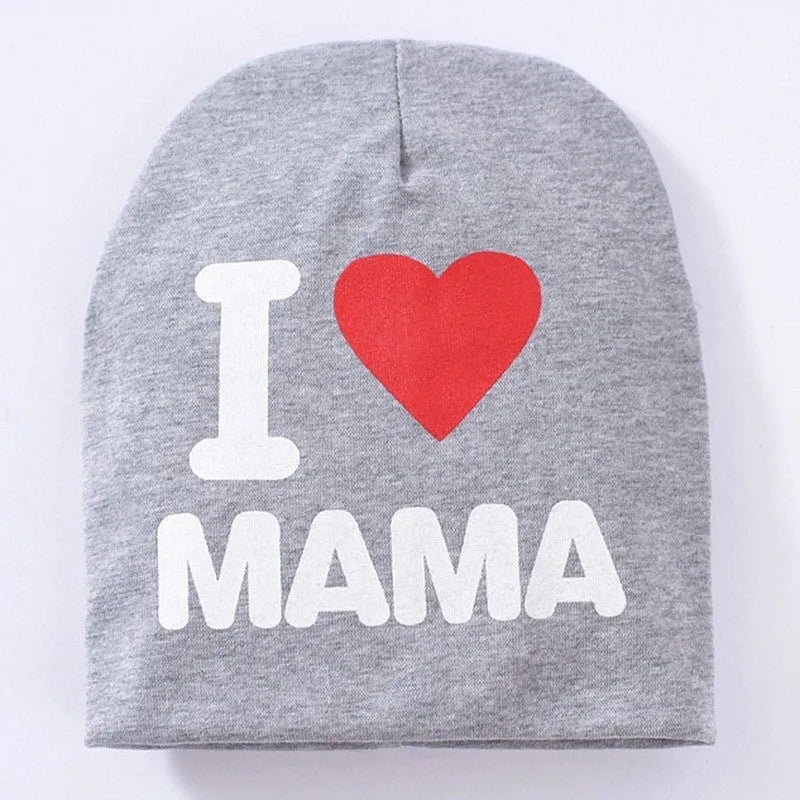 Baby hat in grey with 'Love Mama' text print, showing soft cotton-Lycra knit fabric