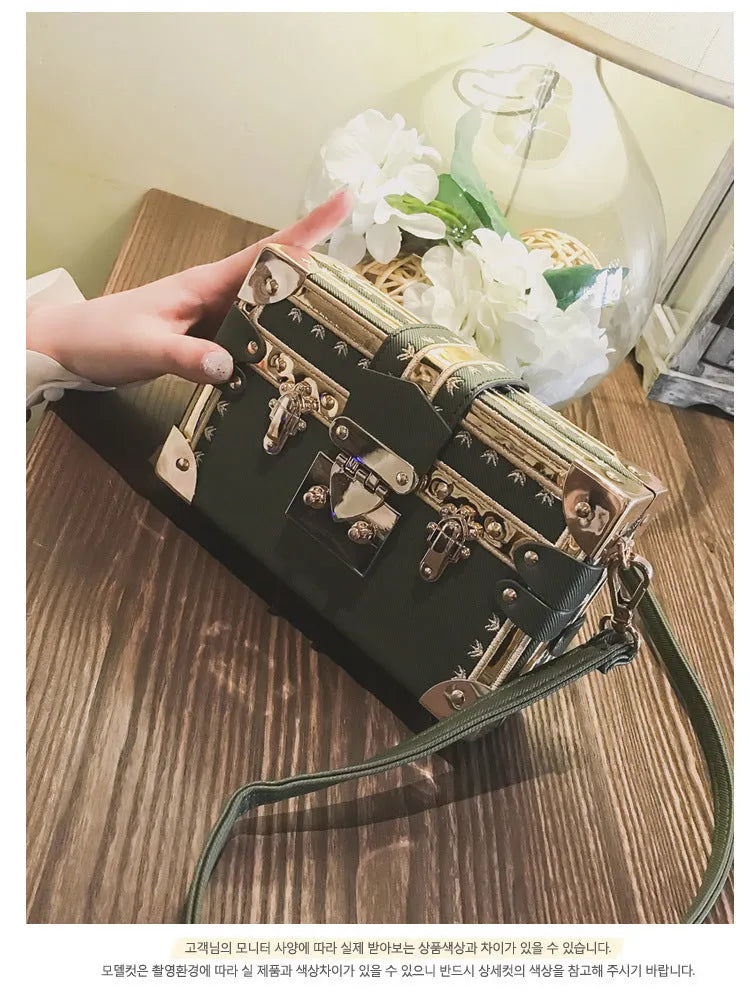Hard black PU women's shoulder handbag with flap, hasp closure, and decorative rivets.