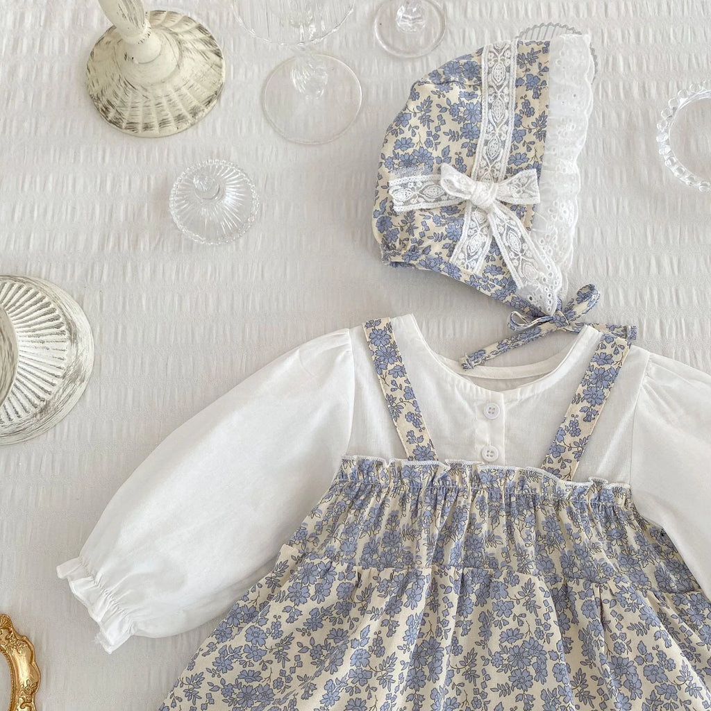 White cotton baby girl floral princess fake two triangle romper with removable hood, long sleeves, front view