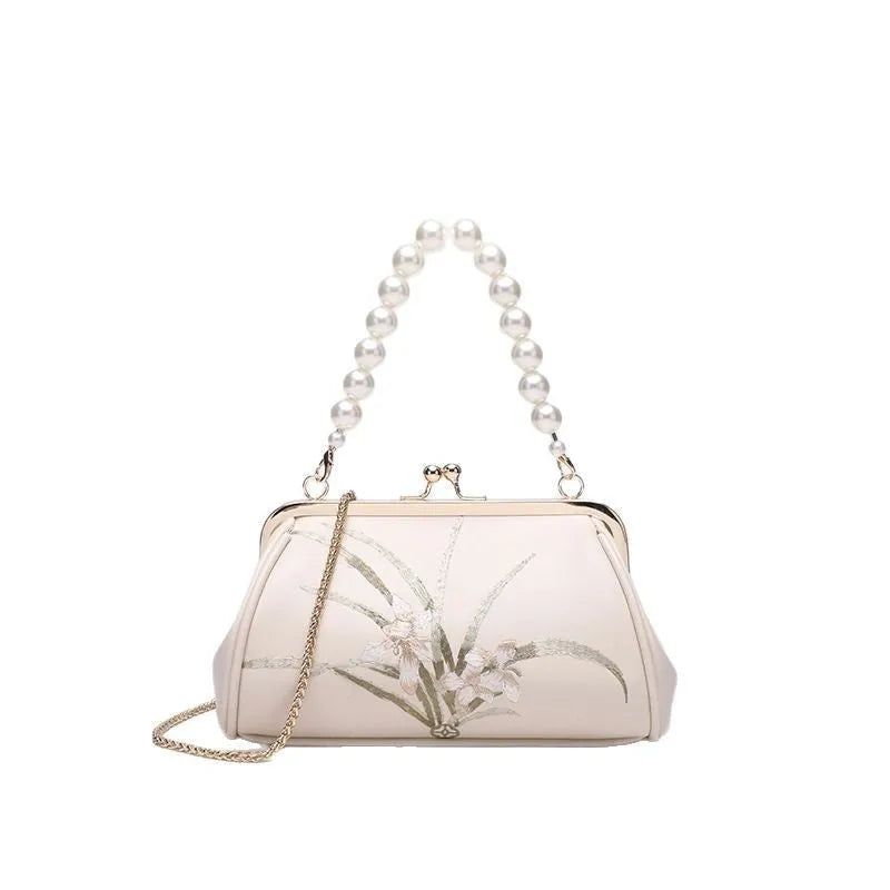 Beige women's embroidered shoulder bag in soft PU leather with shell-shaped design