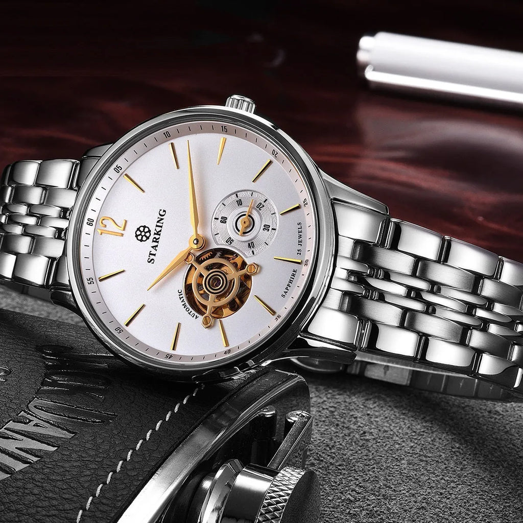 Men's automatic mechanical watch with brown leather strap and white dial on stainless steel case.