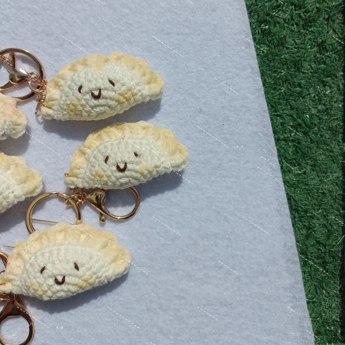 Handmade crochet plush dumpling pendant with keychain in traditional Spring Festival design.