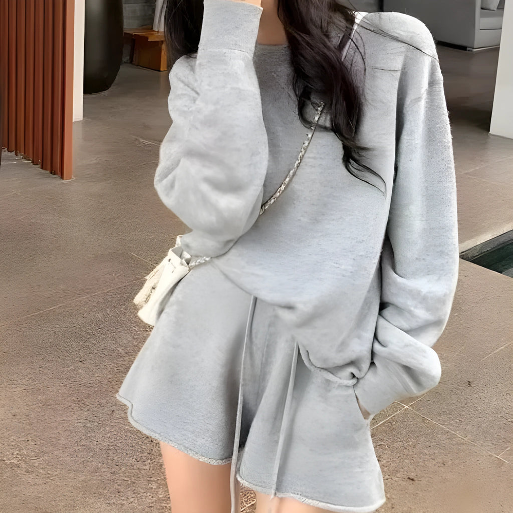 Women's knitted loose-fitting sweater and wide-leg shorts two-piece set in a neutral colour.