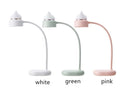 White clip-on LED desk lamp attached to a shelf, showing its USB cable and modern design.