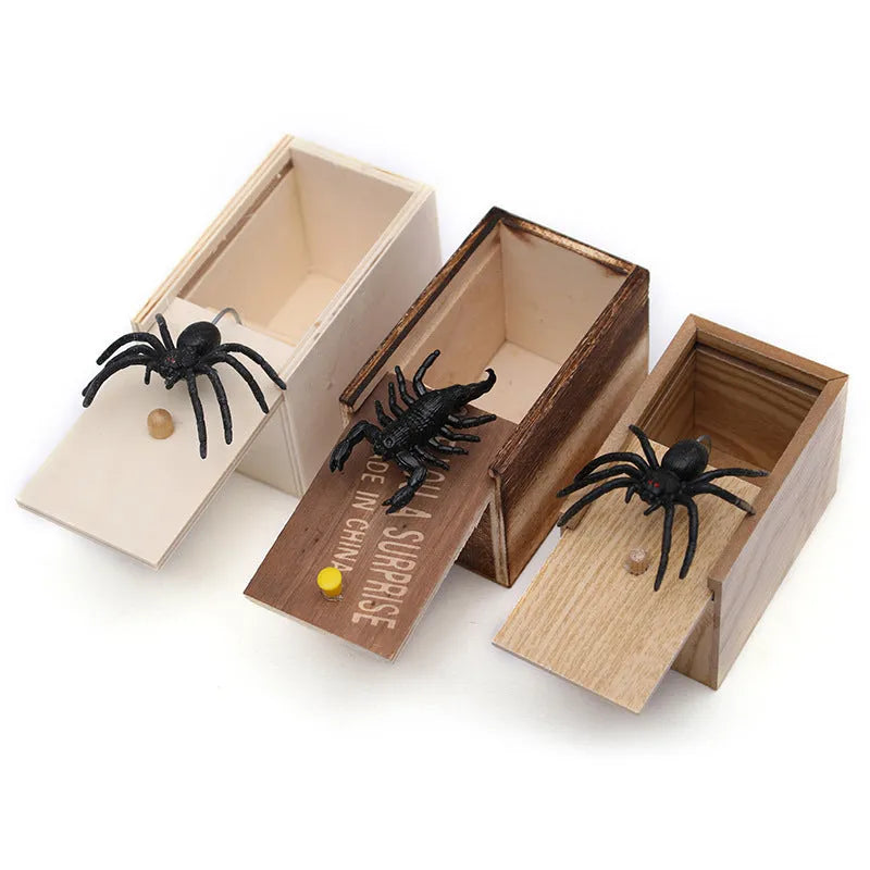 A closed wooden prank scare box measuring 9.1 cm, with a random lifelike animal inside ready to jump out.