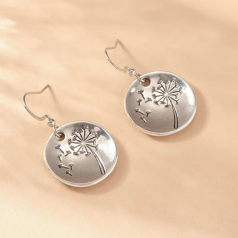 Round dandelion earrings in antique silver finish on zinc alloy for women
