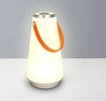 White rechargeable LED lantern night light on a wooden bedside table.