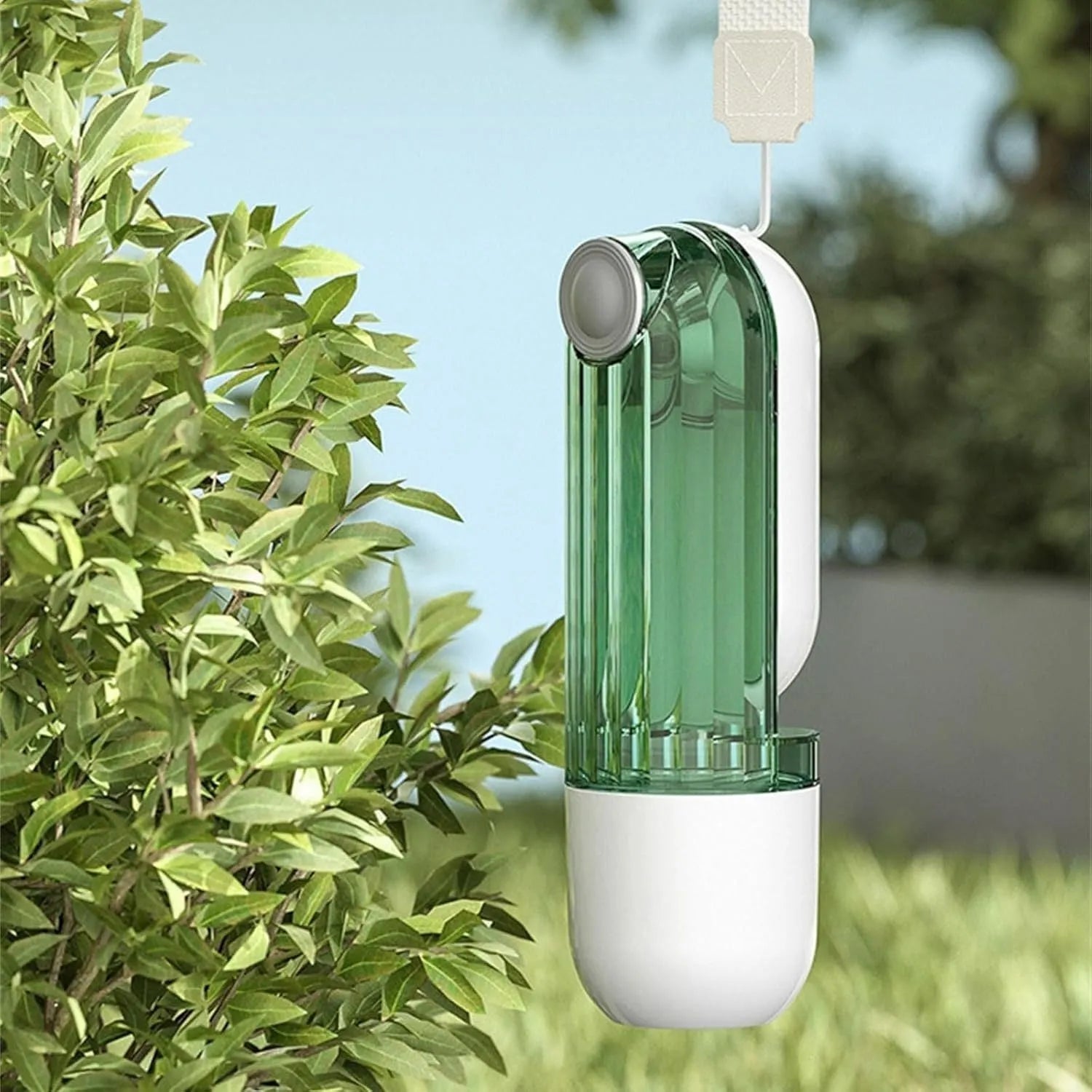 Beige foldable dog water bottle and food dispenser with press mechanism, shown next to a green version.