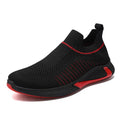 Men's black and white striped mesh slip-on sneakers with flyknit upper and low-cut profile.