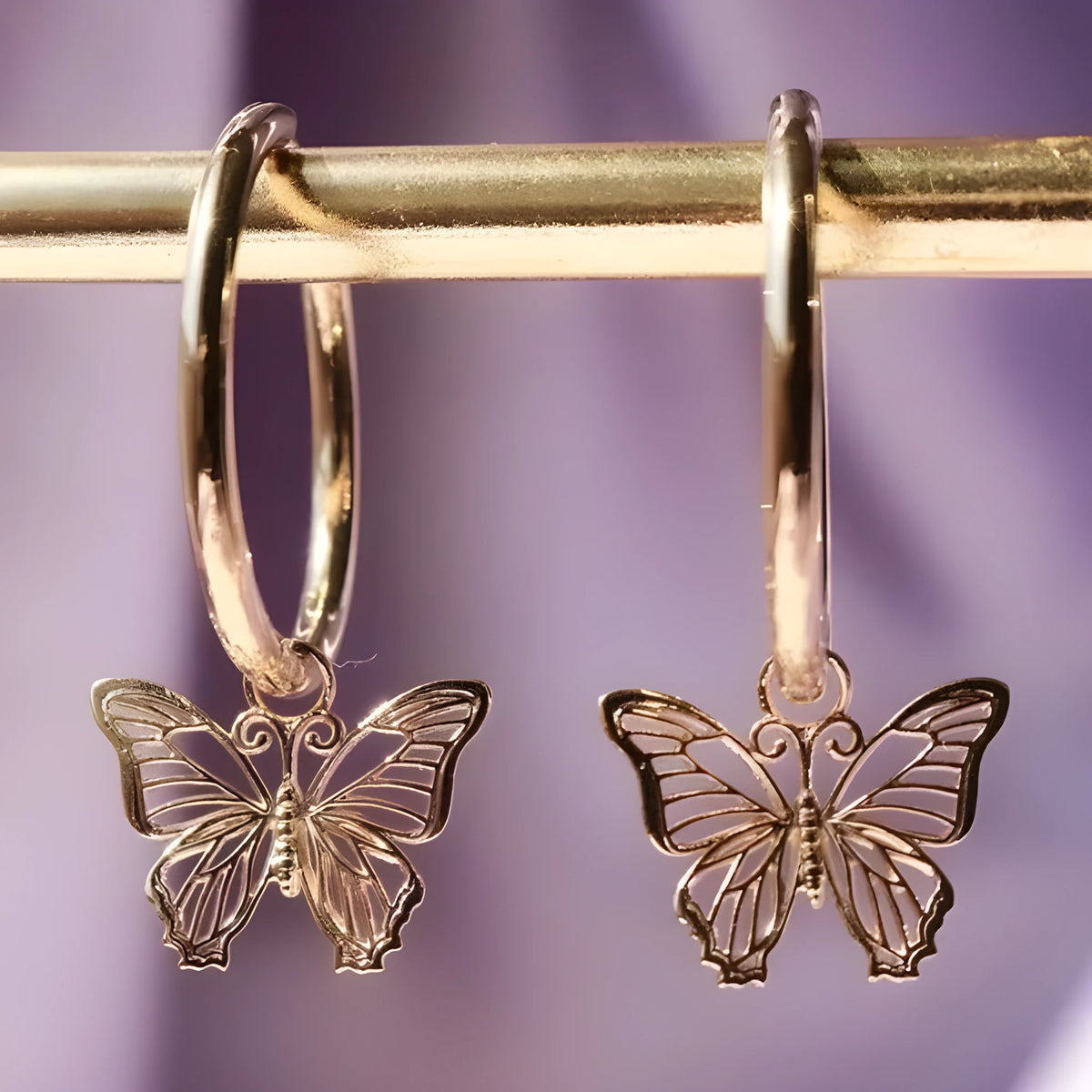 Gold and rose gold butterfly bow stud earrings, electroplated finish on copper alloy base