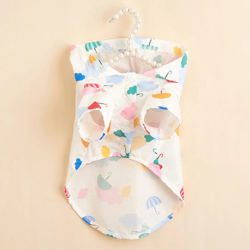 Colourful cartoon umbrella print dog raincoat in polyester, showing sizes XS, S, M, L, XL.