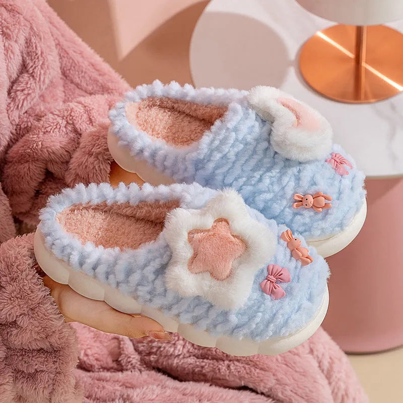 Women's light blue fleece-lined plush home slippers with round heel and PVC sole.