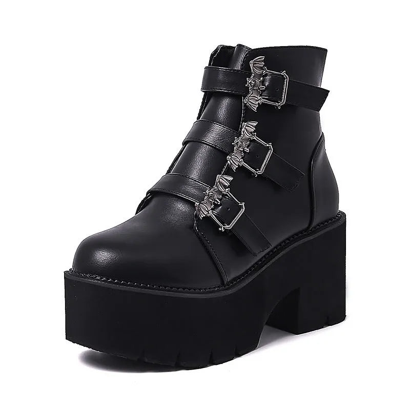 Black women's punk gothic Martin boots with bat buckle detail and side zipper.