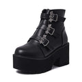 Black women's punk gothic Martin boots with bat buckle detail and side zipper.