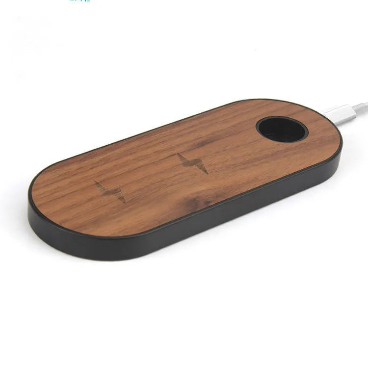 Natural bamboo wireless charging pad with wood accents on desk surface