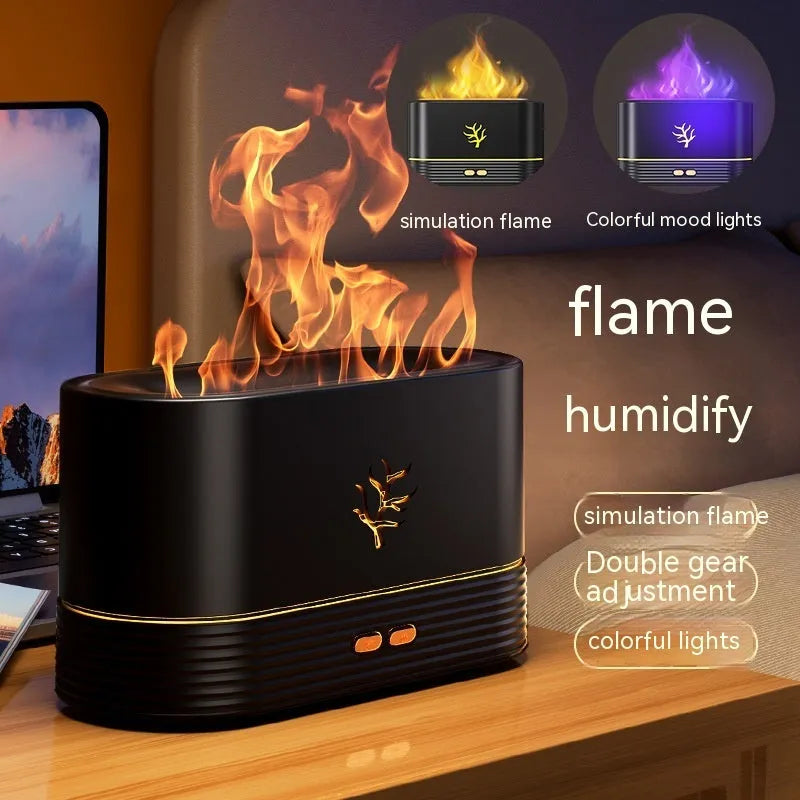 Black square USB aroma diffuser with LED flame light effect and mist output on a wooden table.