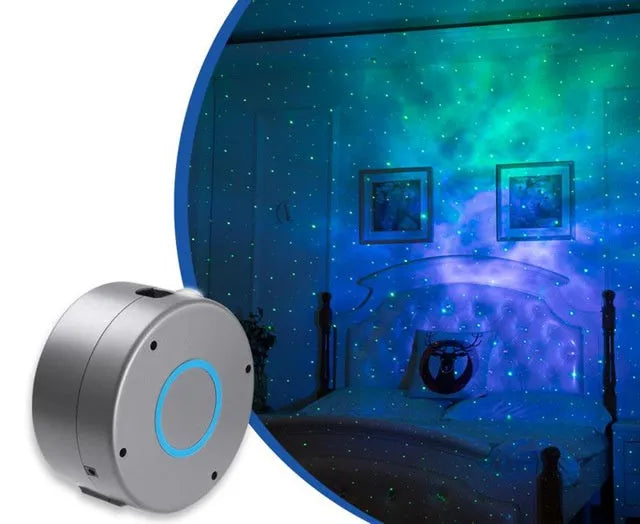 Grey starry sky projection lamp with remote control on a table, projecting colourful light dots on a dark wall.