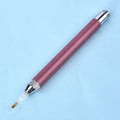 Blue luminous aluminium alloy drill pen for diamond painting and cross stitch crafts on a dark surface.