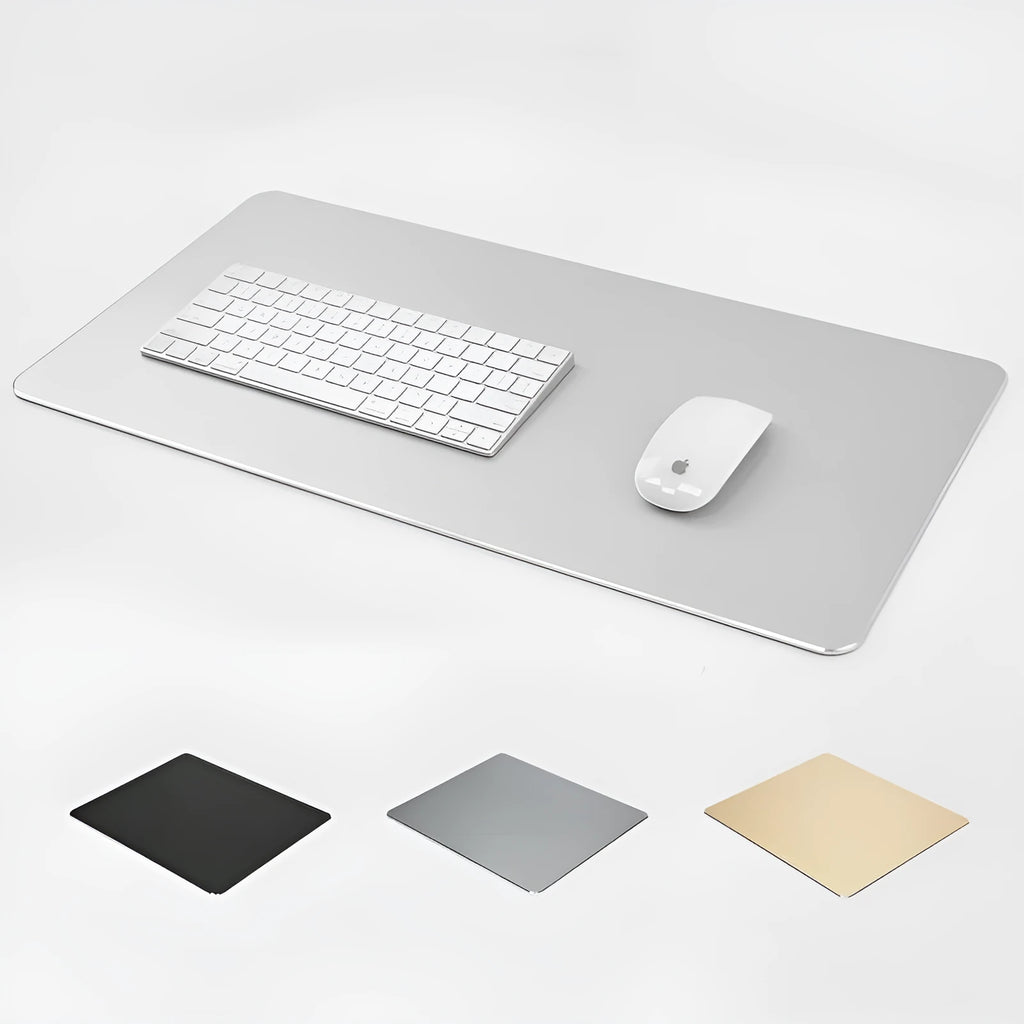 Black aluminium alloy double-sided mouse pad on a desk with a computer mouse on top