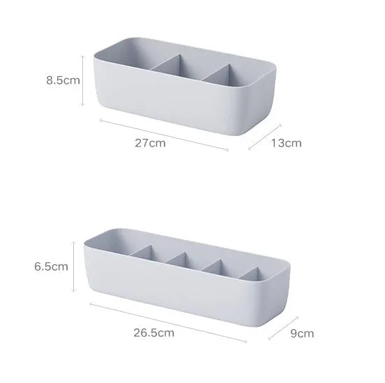 PP plastic socks and underwear storage box with grid compartments in apricot colour on a desktop