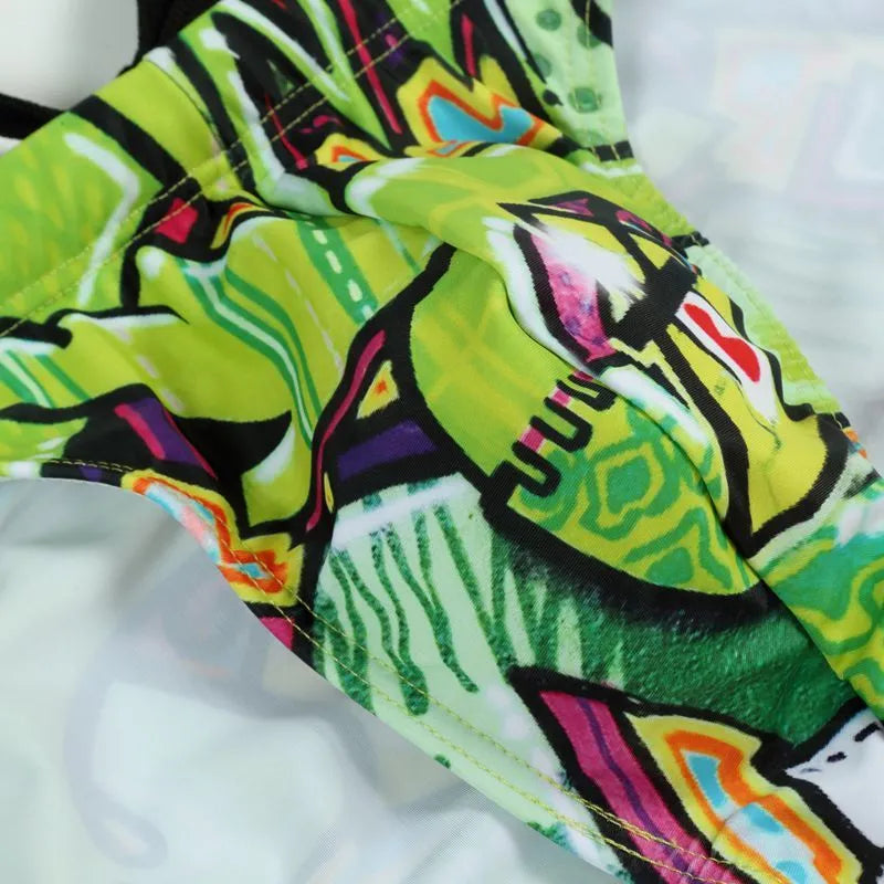 Adult men's printed swimming trunks in polyester, showing pattern options for swimming.