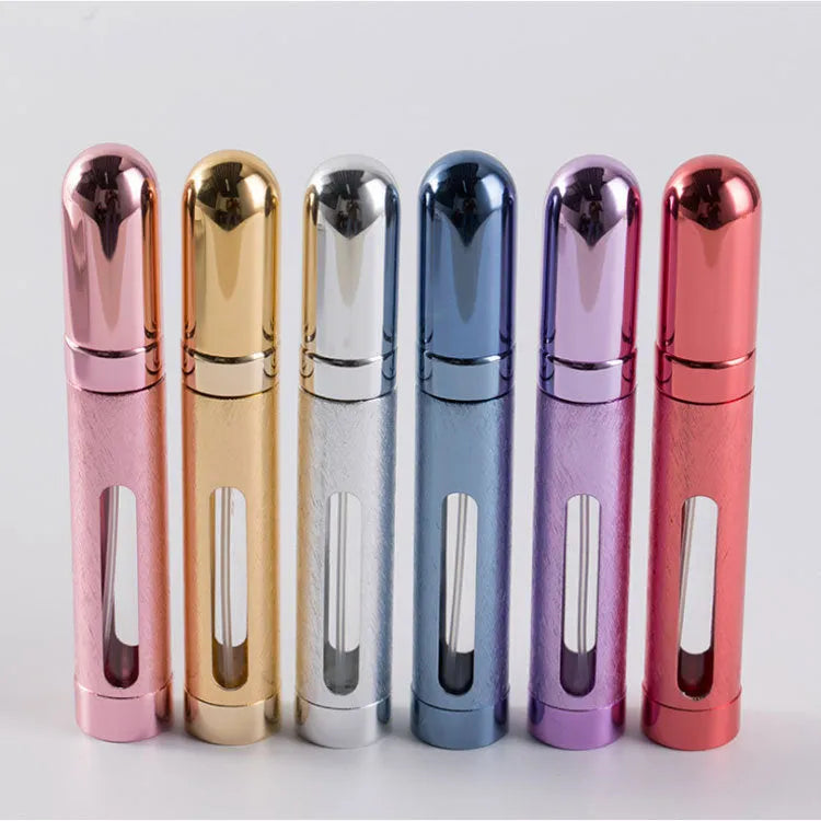 Slim 12ml aluminium travel perfume bottle with glass liner in blue, gold, pink, red, silver, and violet colours.