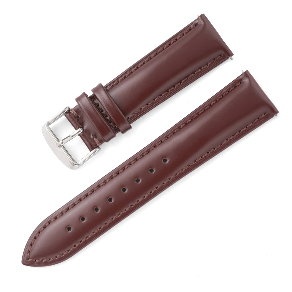 Quick release leather watch strap in black on a watch, showing the ear leather attachment and quick release tabs.
