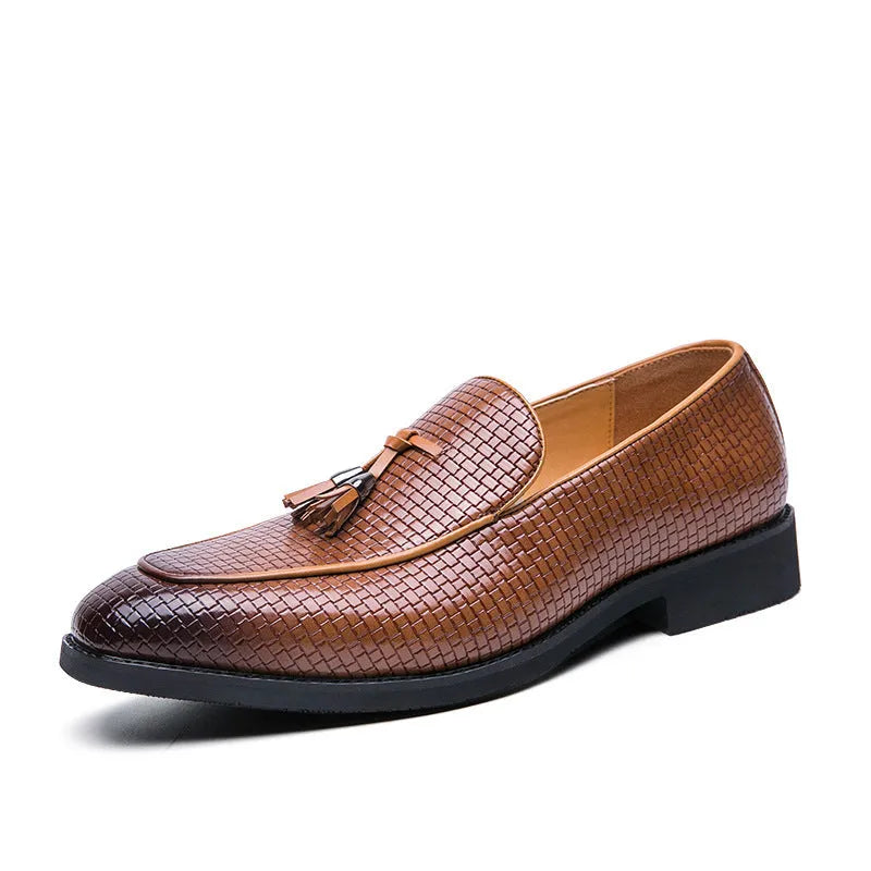 Men's black formal slip-on shoe with pointed toe and decorative tassel on artificial PU upper.