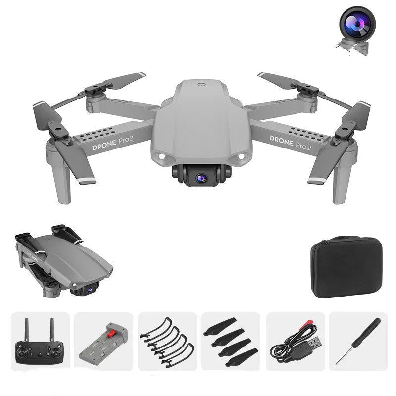 E99Pro2 folding dual camera drone black with propellers on table