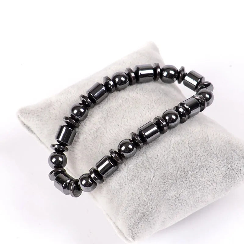 Black stretch bracelet with pentagram stone design, made from magnetite and hematite.